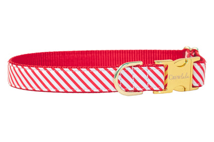 This Christmas-ready dog collar features playful red stripes with a festive candy cane vibe. Finished with a polished buckle and D-ring, it blends durability with holiday style for dogs who love to stand out.
