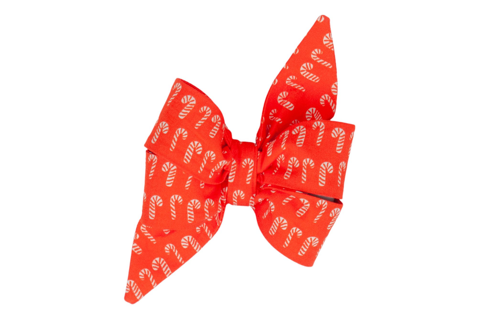Holiday dog accessory in the form of a large, decorative belle bow, crafted from red fabric patterned with striped candy canes. The belle bow has full, gathered loops and elongated tails that give it a feminine look, perfect for adding festive flair to your pup's collar.