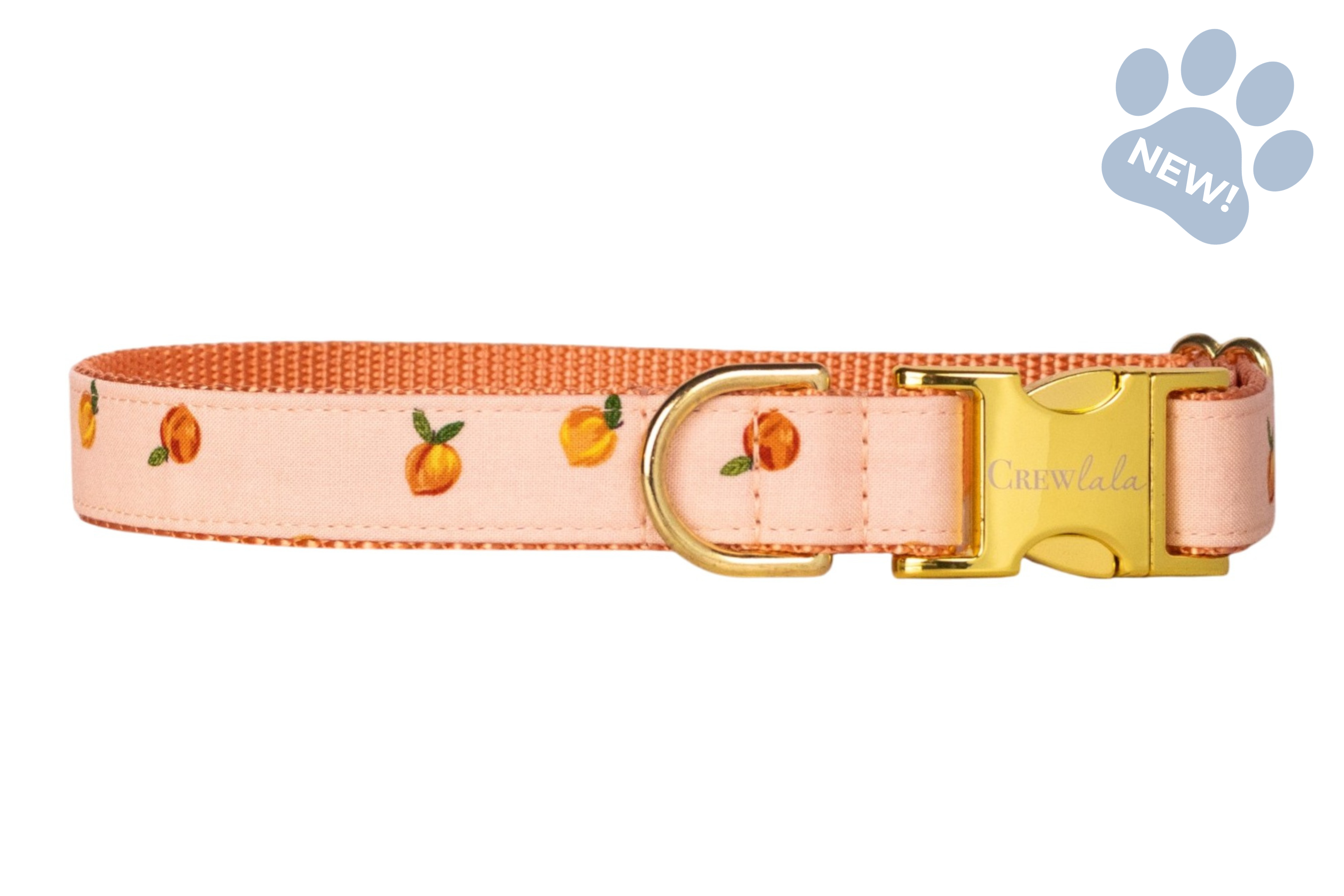 Adjustable dog collar in soft peach with a scattered peach fruit print, featuring an orange lining and gold-tone buckle and D-ring hardware.