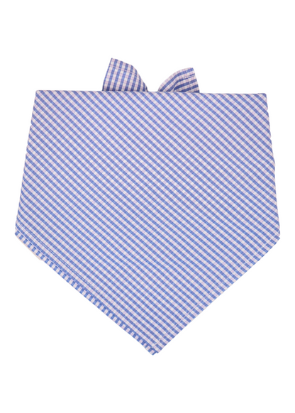 A dog bandana with a classic light blue, light pink, and white gingham check pattern, folded into a triangle shape with the knot and ends visible at the top. The fabric is arranged so the checks appear diagonal across the front.
