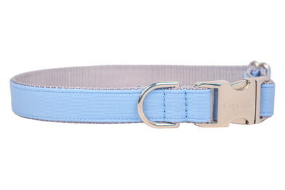 Modern dog collar in soft sky blue with polished silver hardware, designed for both comfort and elegance with a clean, understated aesthetic.