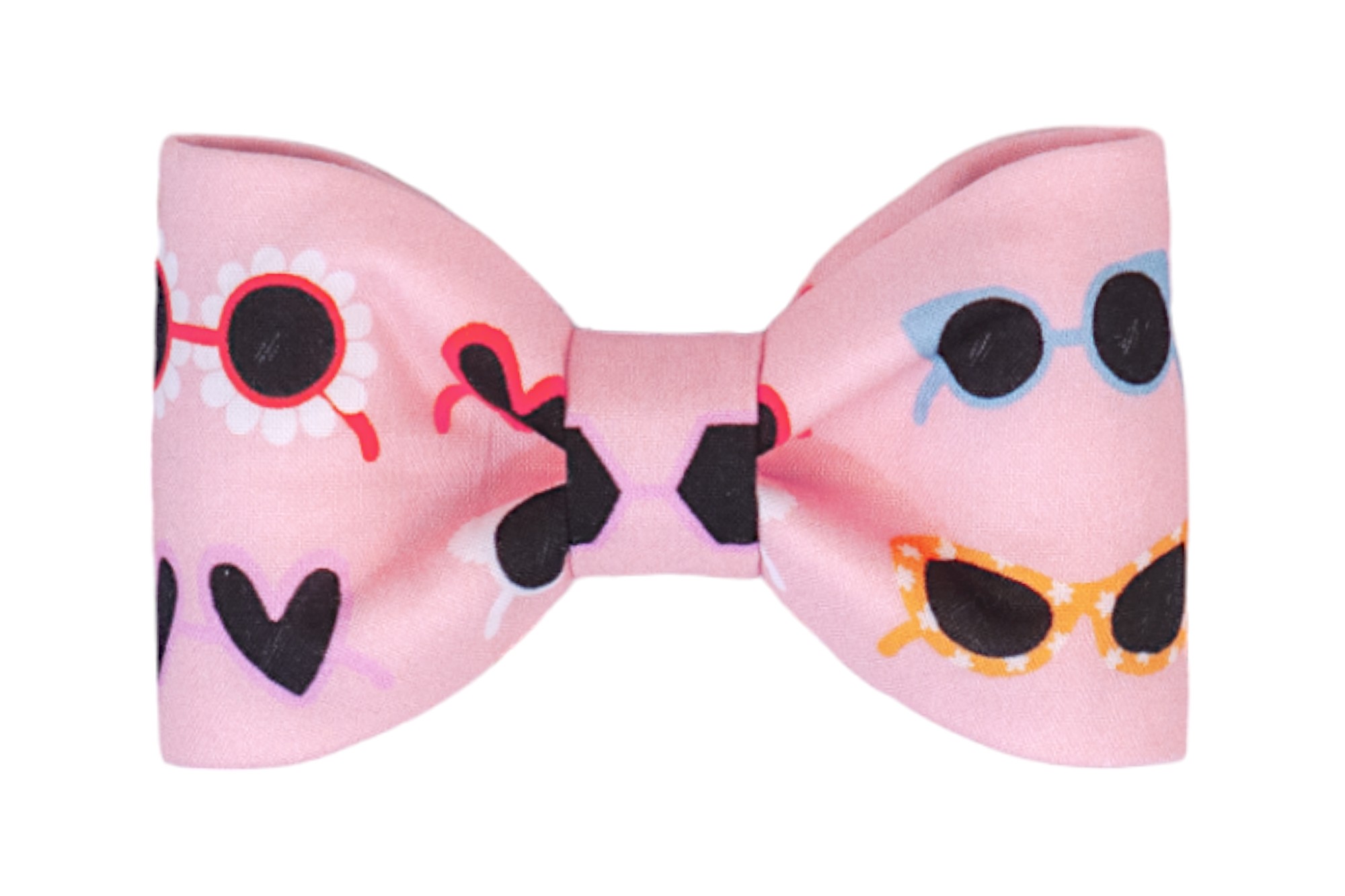 Decorative pink dog bow tie with a novelty print of assorted sunglasses—black hearts, red daisies, blue rounds, and yellow cat-eye styles—scattered across the surface. The bow tie is symmetrical with full, softly gathered sides.
