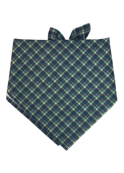 Stylish plaid dog bandana in navy with green, yellow, and light blue tartan lines, cut on the bias for a flattering drape. The triangular shape and tie-back design make it easy to wear, while the soft, lightweight fabric provides comfort for all-day use.