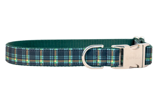 High-quality, adjustable dog collar covered in a timeless plaid fabric, layered over durable nylon webbing. Designed with a metal engraved buckle and sturdy D-ring for secure attachment, this collar combines classic style with practical functionality for everyday wear or special occasions.