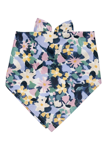A dog bandana with a painterly watercolor floral design. The bandana ties at the neck and complements other matching accessories in the Petal Pop Collection.
