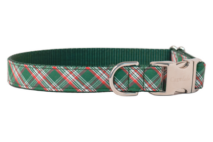 Holiday-ready dog collar in green plaid with red and white accents, finished with luxe gold-tone hardware. Includes an engraved side-release buckle and sturdy D-ring, combining fashion and function in one festive accessory.