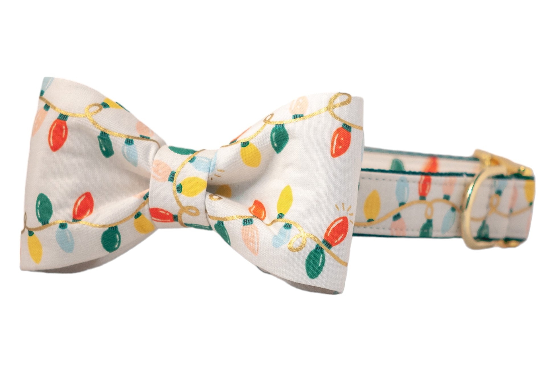 Christmas-themed bow tie dog collar featuring a light beige base with playful multicolored string lights. The bow tie and collar are both printed with red, green, and other festive colors on wire. The collar is finished with a shiny metal buckle for a polished holiday look.