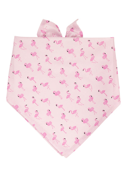 Flamingo-themed dog bandana in pastel pink, decorated with numerous pink flamingos standing and walking. The fabric is neatly folded with tie ends for easy wear.