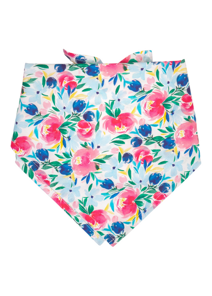 Bright, watercolor-style bandana with a pastel blue base and a bold mix of fuchsia, blue, and yellow Spring floral elements. The top is tied into two upright fabric tips.