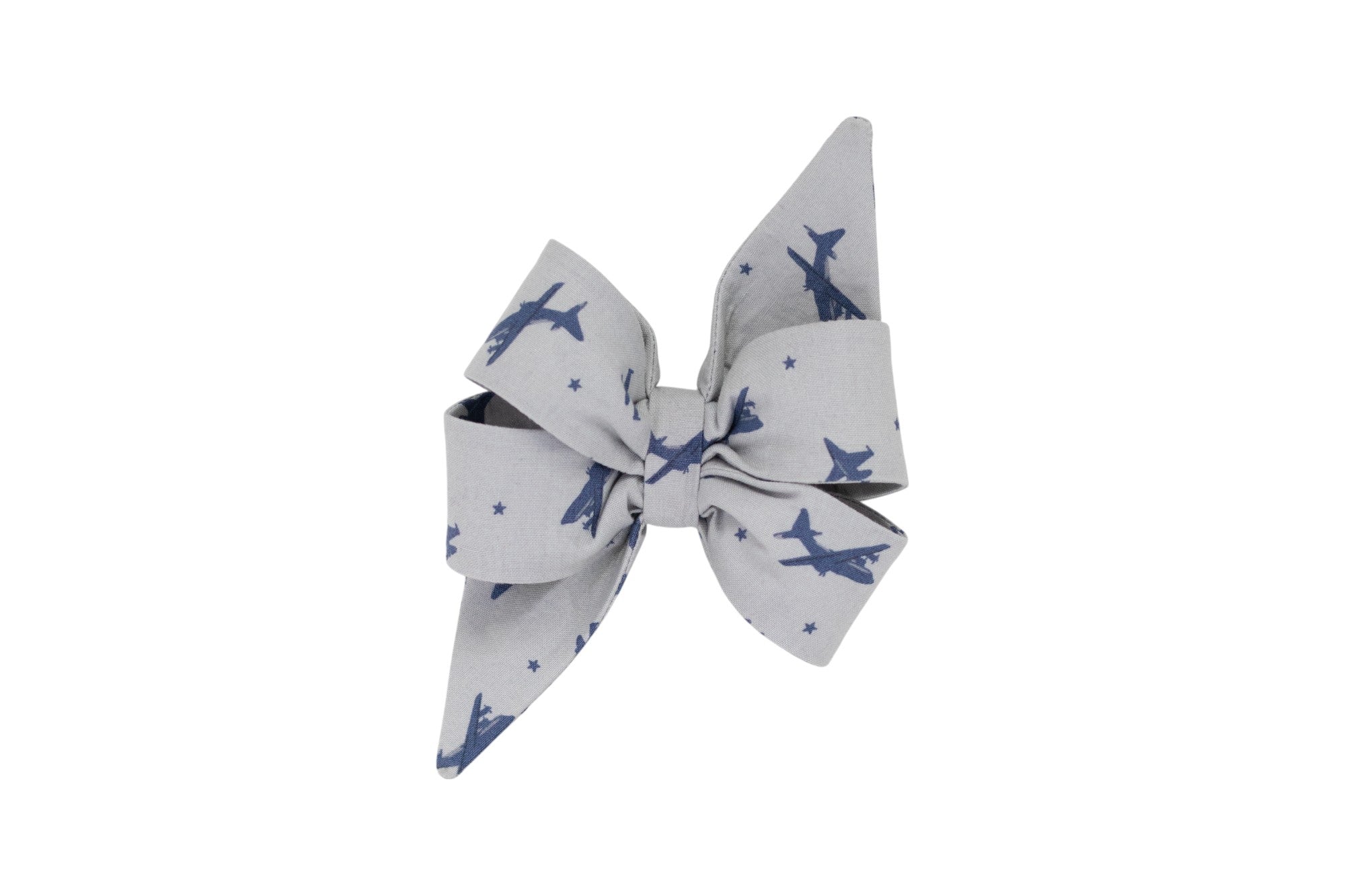 Adventure ready girl dog belle bow featuring a navy blue airplane and star pattern on a light gray background—perfect for pups on the go.