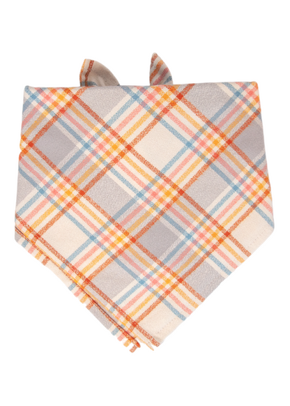Dog bandana made of flannel fabric, showcasing a vibrant diagonal plaid pattern in muted tones. The bandana is tied at the back, and the pointed end hangs down for a stylish, comfortable fit.