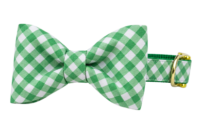 Classic dog collar featuring a Garden Lattice fabric bow tie, a kelly green and white gingham check, attached to a matching Garden Lattice collar with a nylon inner lining and gleaming gold hardware, including a D-ring and buckle.