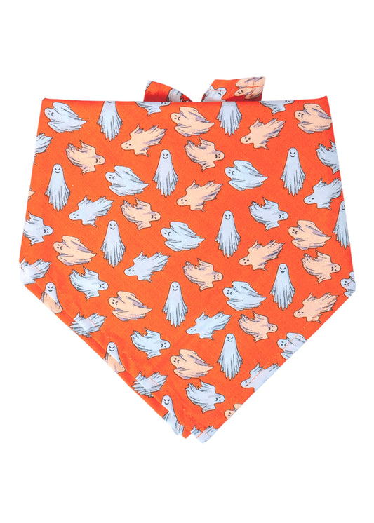 Bright orange Halloween dog bandana covered in scattered cartoon-style ghosts. The ghosts vary in playful floating poses and glow in the dark, making the bandana not only festive but also fun for evening walks.