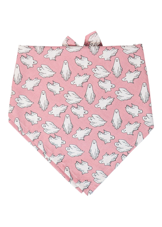 Pink Halloween dog bandana covered in scattered cartoon-style ghosts. The ghosts vary in playful floating poses and glow in the dark, making the bandana not only festive but also fun for evening walks.