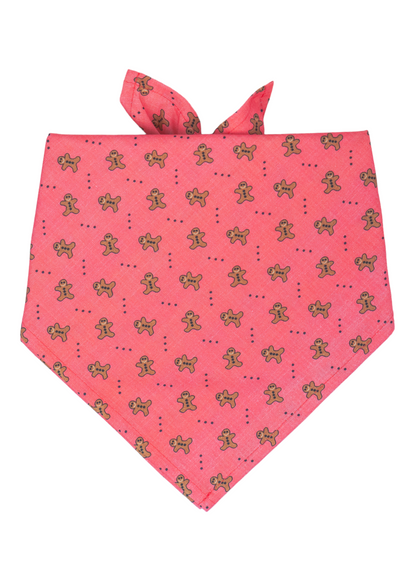 Get your dog holiday-party ready with this adorable red bandana, sprinkled with smiling gingerbread men and tiny dotted accents. It’s the paw-fect finishing touch for festive frolics and photos alike.