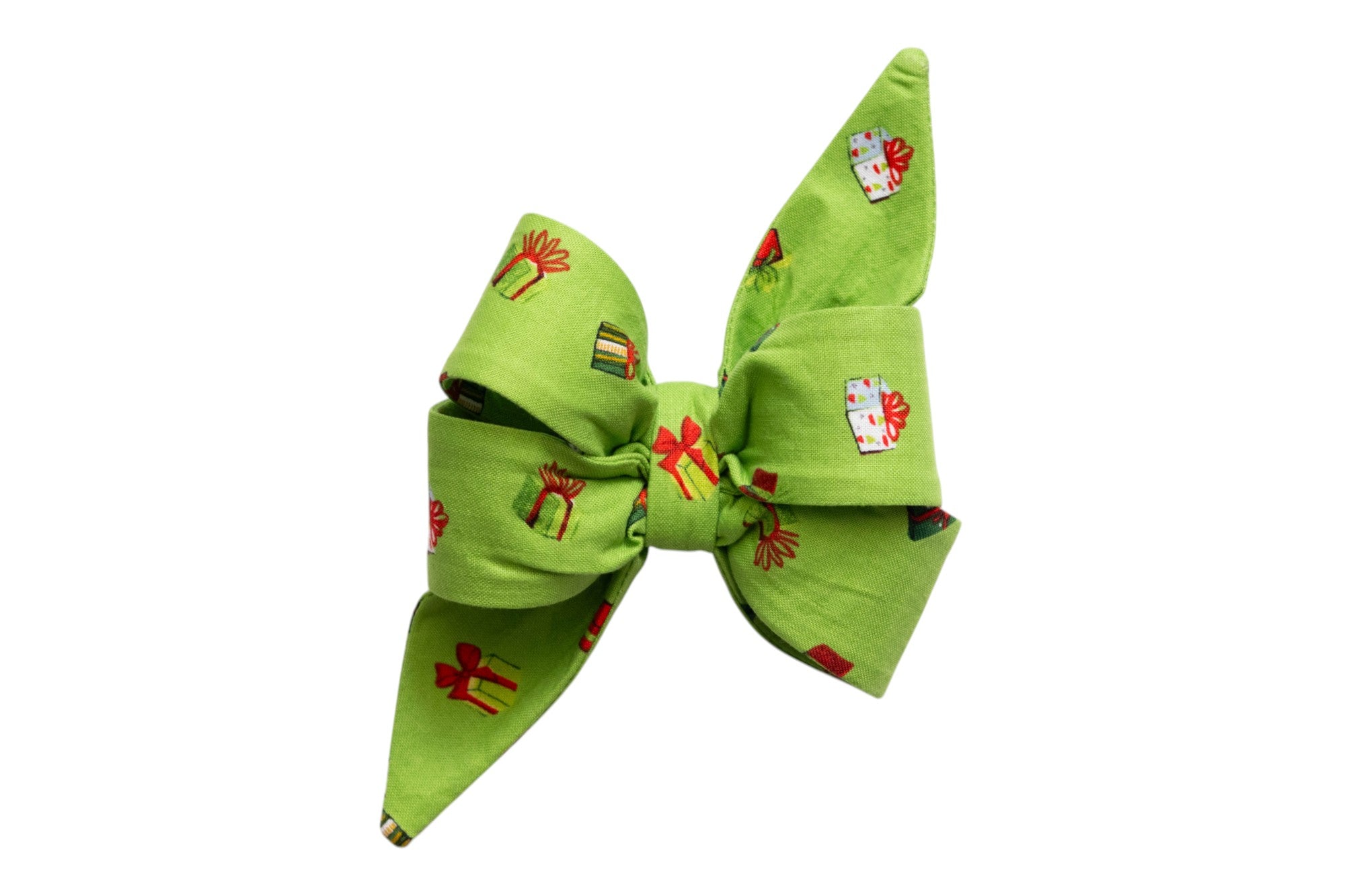 Festive standalone dog bow tie in green with a repeating gift box print in festive colors. The design is full and structured, with dramatic pointed ends and a pleated center, ideal for a bold, feminine holiday look.