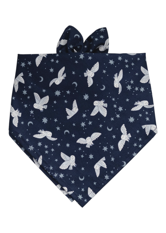 Dog bandana featuring a nighttime theme with illustrated owls, stars, and crescent moons on a deep blue background.