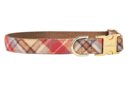Fall-themed plaid dog collar in warm hues, made from durable flannel material with a metal D-ring and matching engraved side-release buckle.