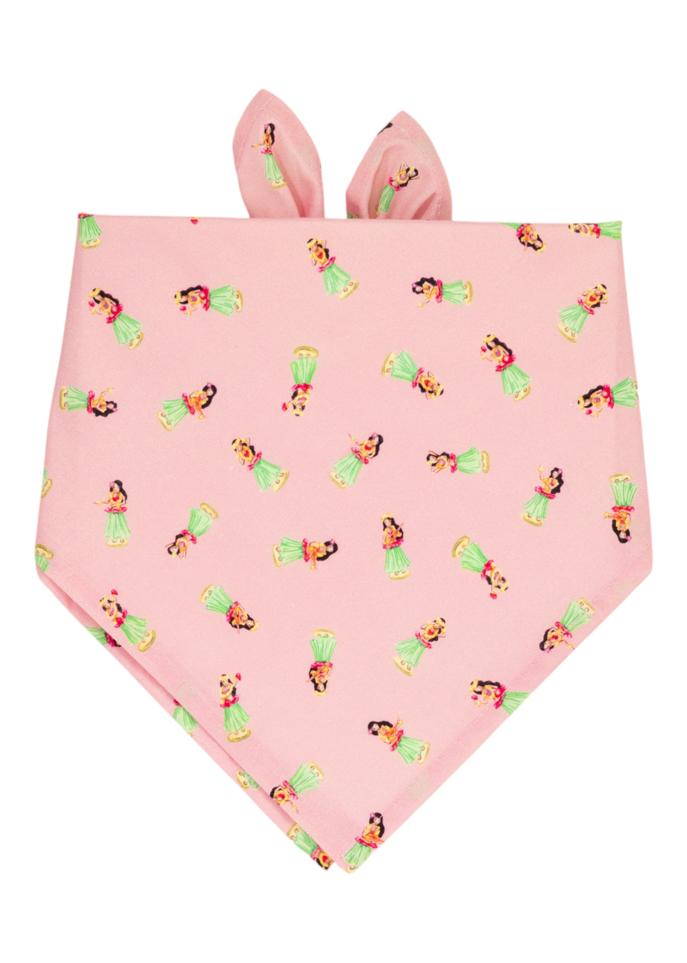 Tropical-print pink dog bandana featuring an all-over hula dancer pattern, folded into a triangle.