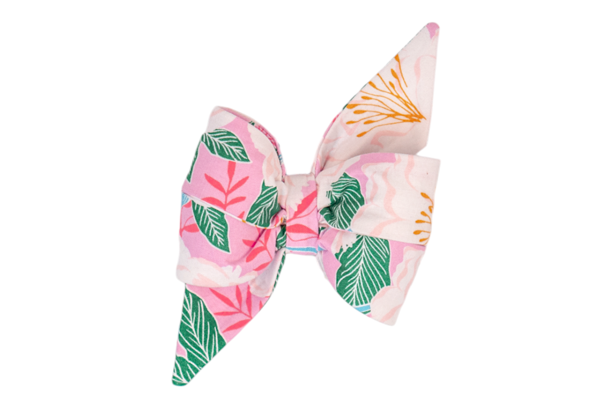 Feminine dog belle bow in a pink floral print featuring large white blooms with golden stamens, deep green and coral foliage, and dramatic pointed ends for a stylish, standout accessory.