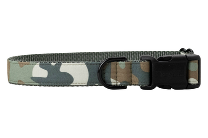 Camo-print dog collar featuring rugged stitching, a sturdy side-release buckle, and a metal D-ring—made for pups who like to walk on the wild side.