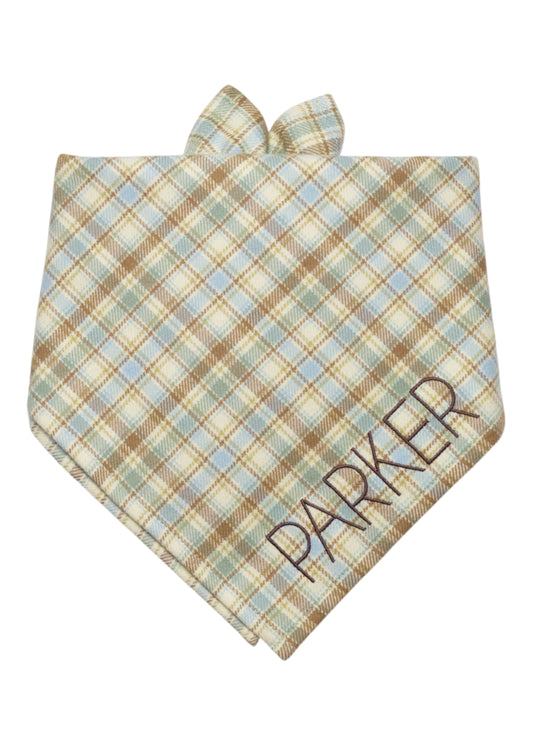 A classic plaid dog bandana with a personalized twist—this comfy cotton flannel accessory can be embroidered with your pet’s name for standout style.