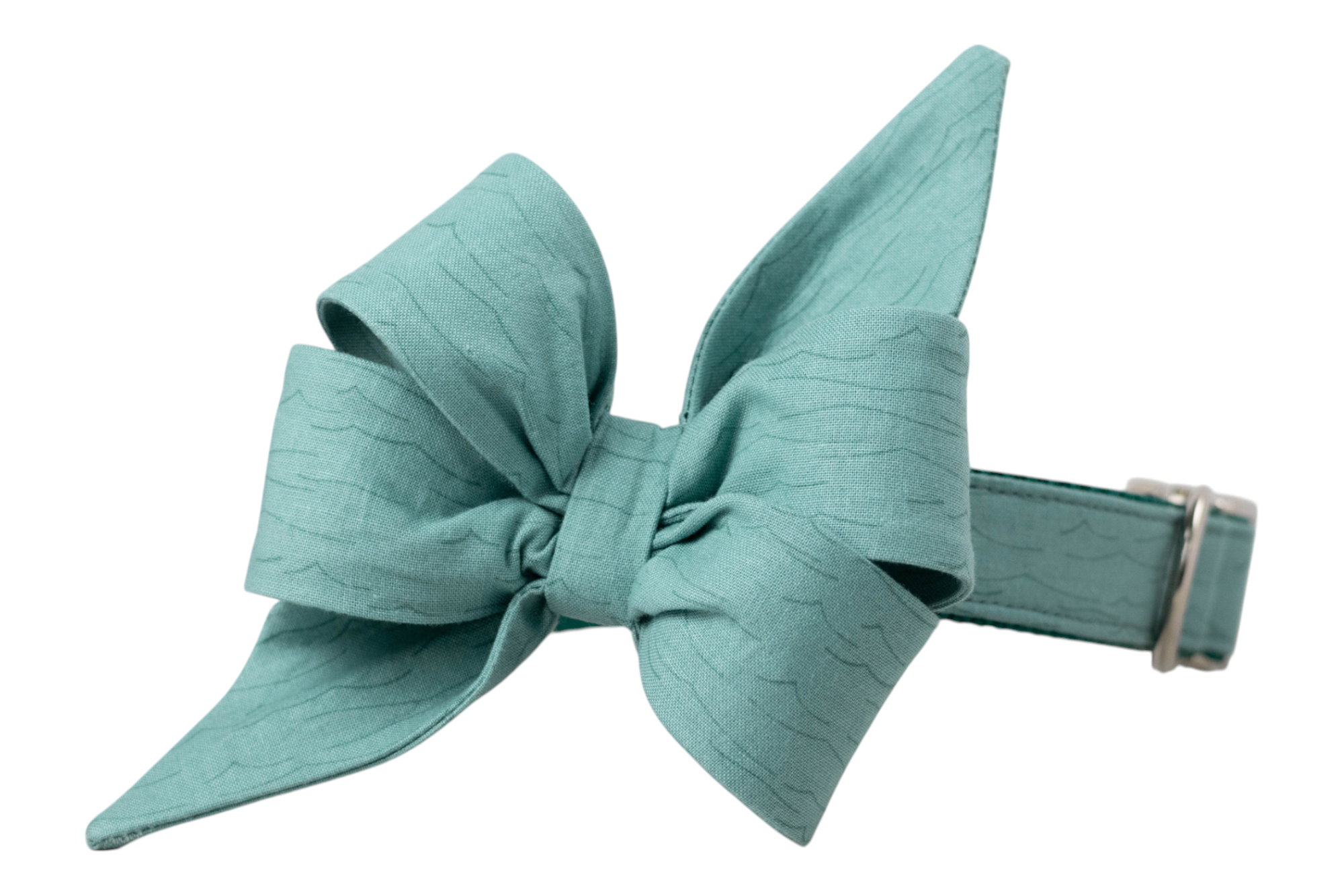 Textured teal dog collar with a large, structured  girls belle bow in matching fabric, designed with soft wave-like patterns and pointed tails. 
