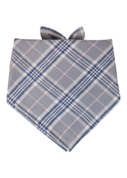 Soft grey dog bandana made of cozy flannel fabric, adorned with a traditional tartan design, made to be tied around a dog’s neck.