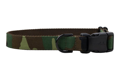 Adjustable dog collar featuring a classic camo print and black hardware, including a buckle engraved with “Crewlala.”