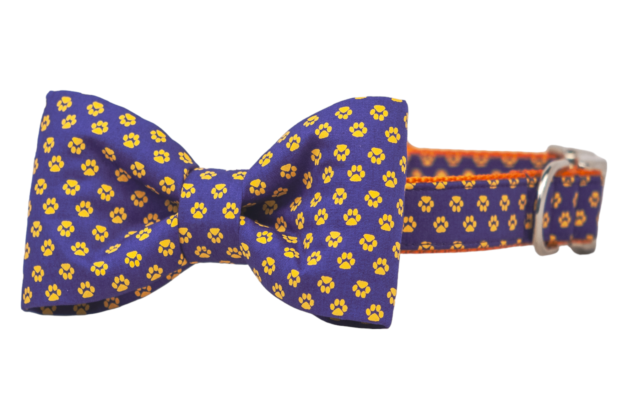 Let your dog shine in this bow tie collar with bold paw prints on deep navy and a bright nylon webbing lining. Whether it’s game day or photo day, this accessory delivers serious style points.