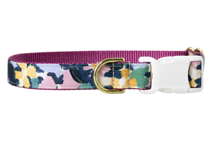 A floral dog collar featuring a pastel print thats perfect for fall. It includes a nylon woven backing, metal D-ring, and a buckle engraved with "Crewlala."