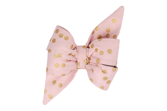 Beautifully crafted blush pink girl dog belle bow adorned with metallic gold dots, perfect for special occasions, celebrations, or a touch of everyday whimsy.