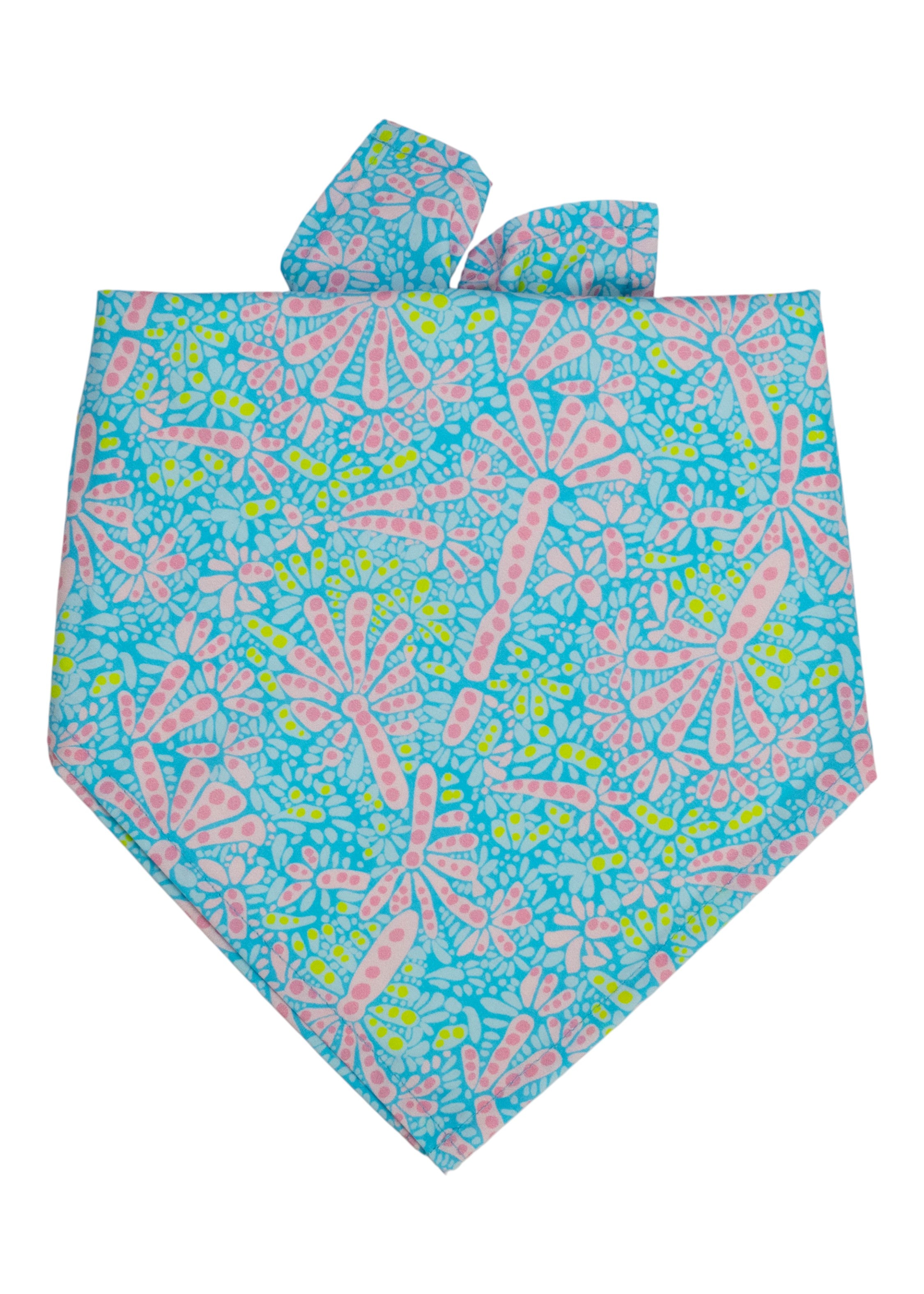 Vibrant dog bandana with a whimsical design of pink and colorful abstract shapes on a bright background.