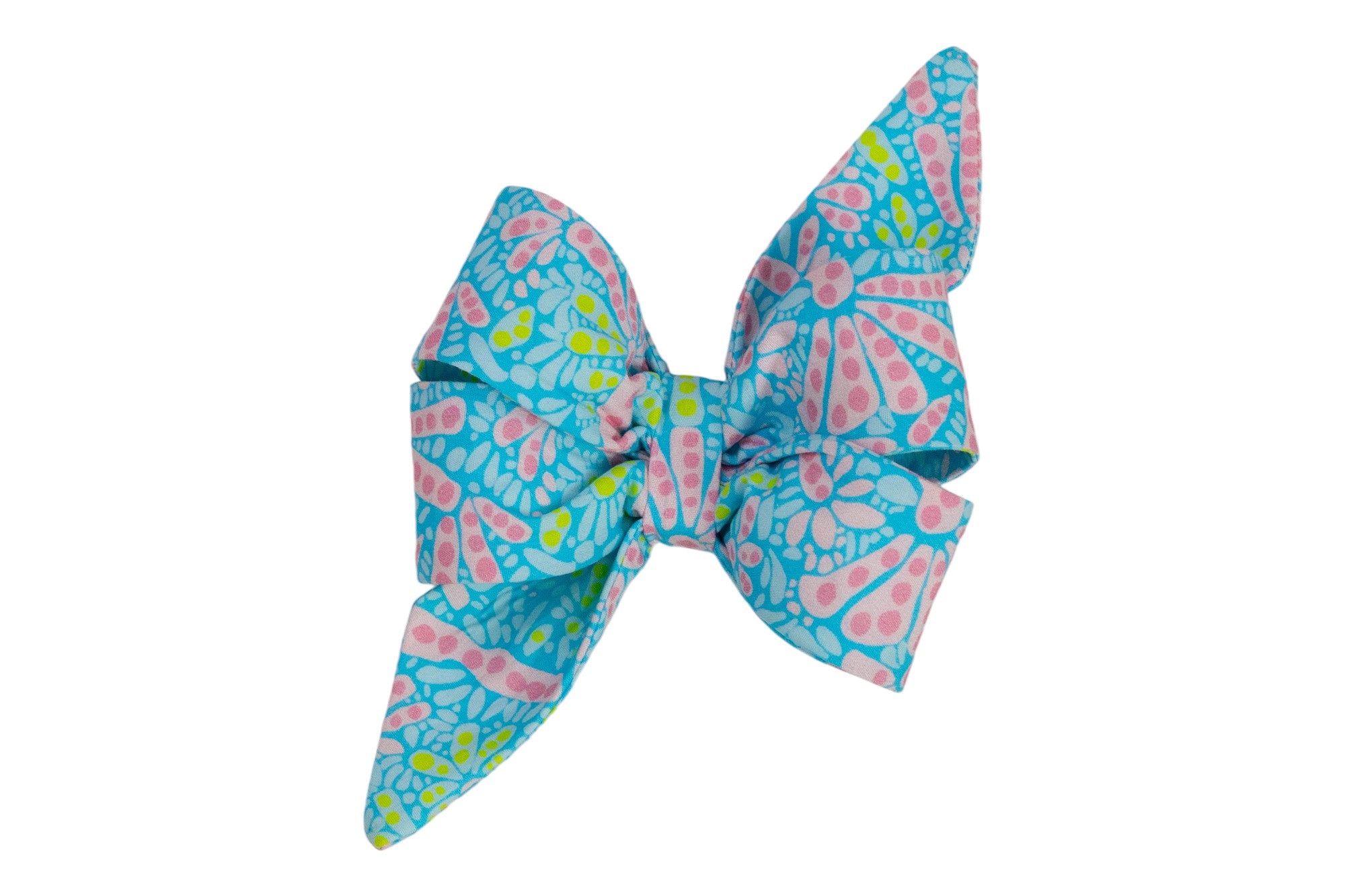A large belle bow with pointed tails, featuring a bright background and a playful pattern of pink abstract flowers.