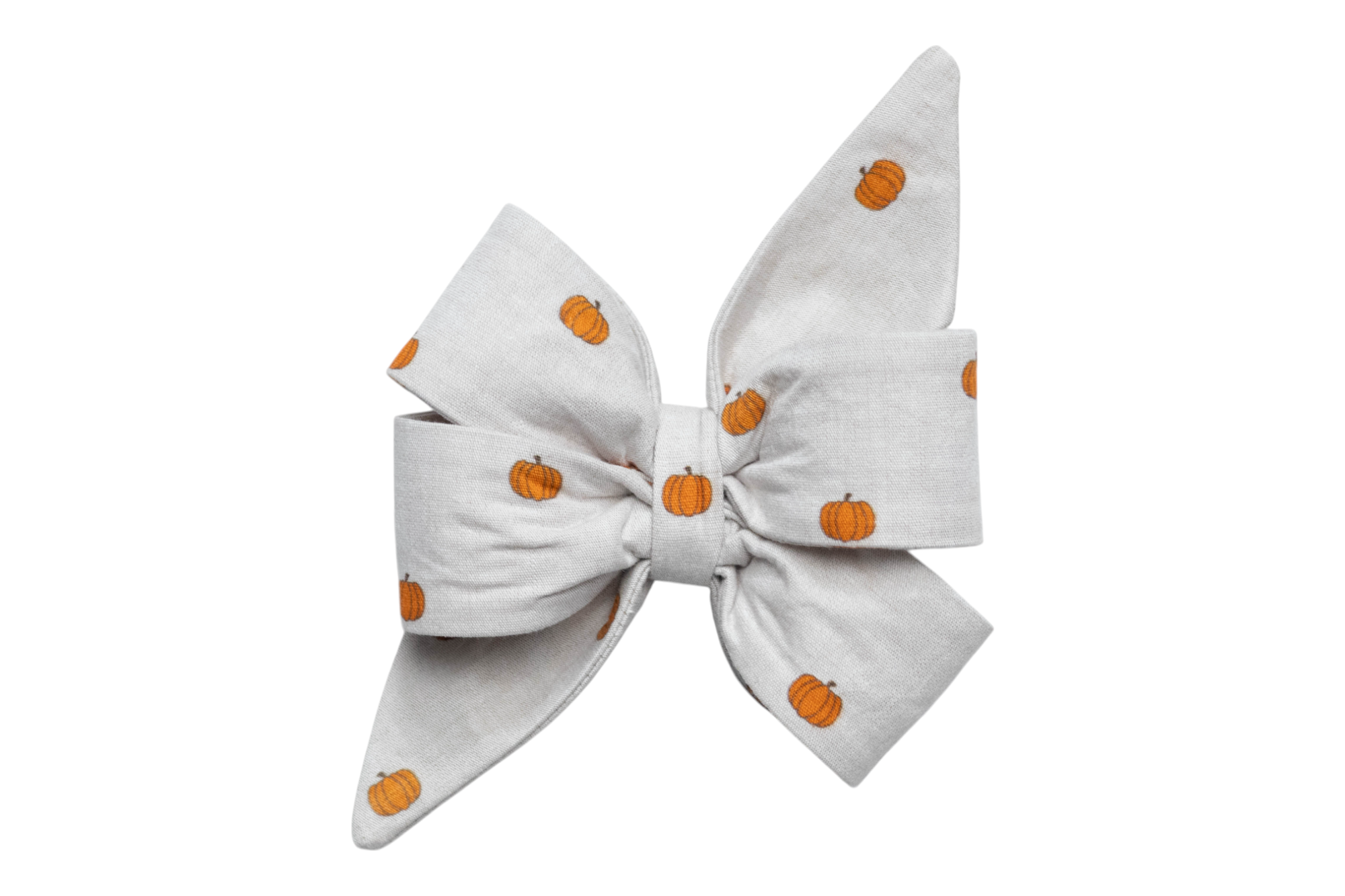 A large dog belle bow made from beige fabric with a repeating pattern of small pumpkins. The belle bow features layered loops and two long, pointed tails for a structured, elegant look. A subtle and stylish accessory for fall outings, pumpkin patch visits, or Halloween celebrations.