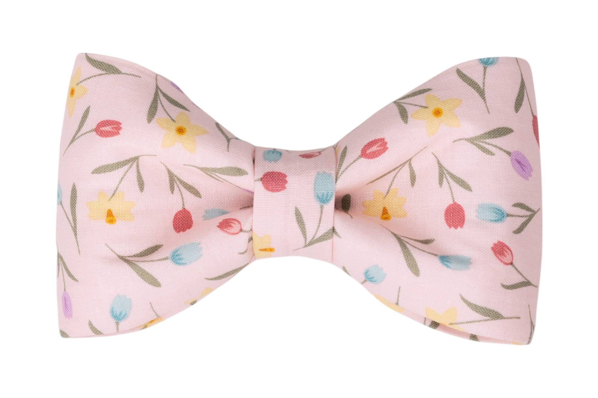 A pastel pink dog bow tie featuring a playful floral pattern with tulips and daffodils in shades of yellow, red, blue, and lavender, accented by green stems and leaves. Great for Spring!