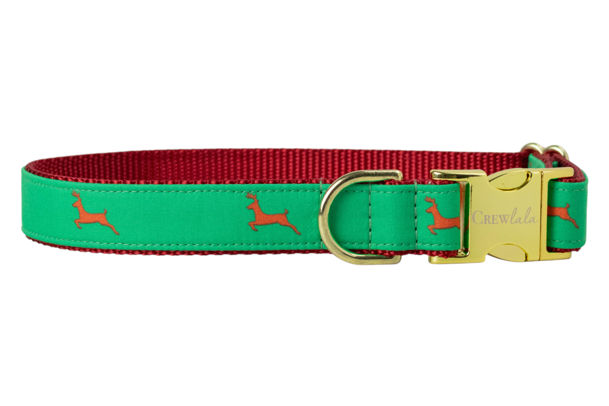 A festive dog collar with a green fabric overlay printed with reindeer silhouettes. The collar is backed with woven webbing and features luxe hardware, including a buckle engraved with “Crewlala.”