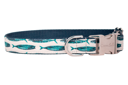  Dog collar with a nautical theme, featuring turquoise and navy mackerel fish prints on an off-white background, complemented by a deep teal interior and silver hardware.
