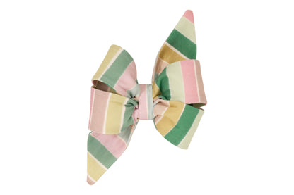 A decorative belle bow for dogs with long pointed tails, made of fabric featuring wide pastel stripes in pink, green, yellow, and tan.