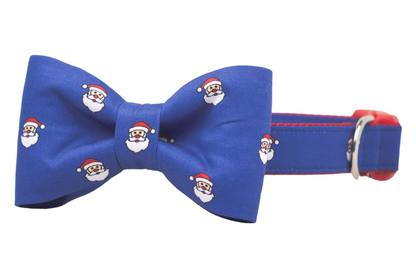 Get your pup holiday-party ready with this blue Santa-themed collar and matching bow tie, finished with bright nylon webbing lining and a metal leash ring—because good boys and girls deserve great style.