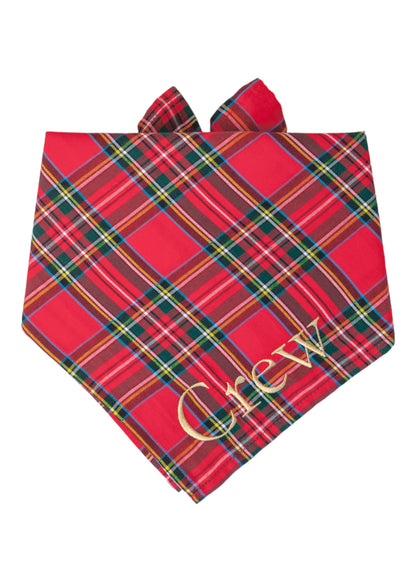 Holiday dog bandana featuring a bold red background and multicolor plaid stripes in classic hues—crafted in soft fabric with tie-on style for timeless Christmas cheer. The name "Crew" is embroidered on the bottom right.