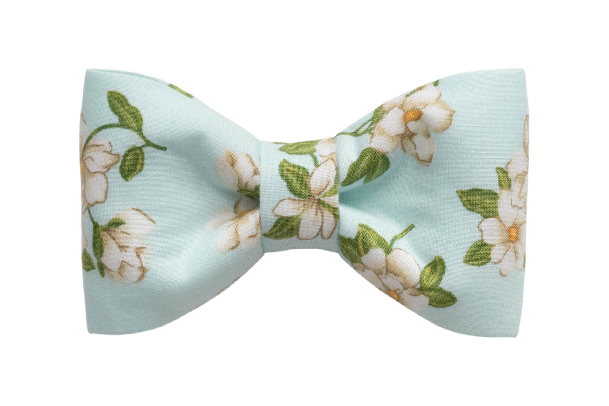 Pastel blue dog bow tie with white flower pattern and soft green leaves, a charming floral collar accessory.