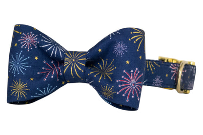 Fireworks-themed dog bow tie and collar set, featuring vibrant bursts of color and golden accents on a navy background. Perfect for July 4th or everyday!