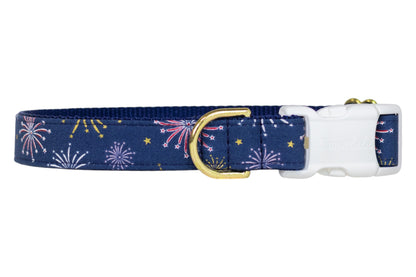 Stylish navy dog collar adorned with colorful fireworks and golden stars, finished with a white buckle and a gold D-ring. Perfect for July 4th or everyday!