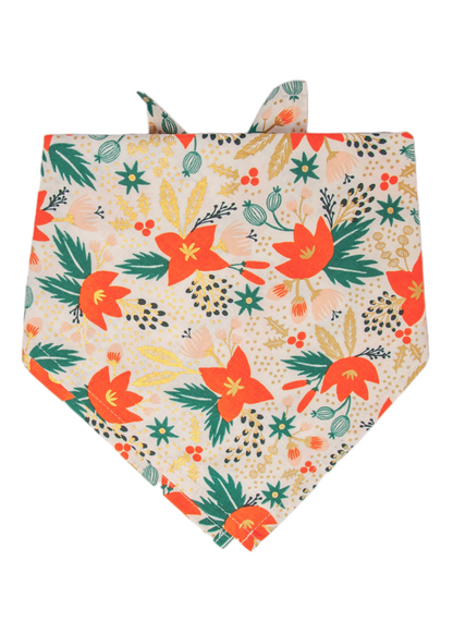 A festive dog bandana with a vibrant mix of orange florals, foliage, and metallic accents on a soft light background — the perfect seasonal accessory for stylish pups.