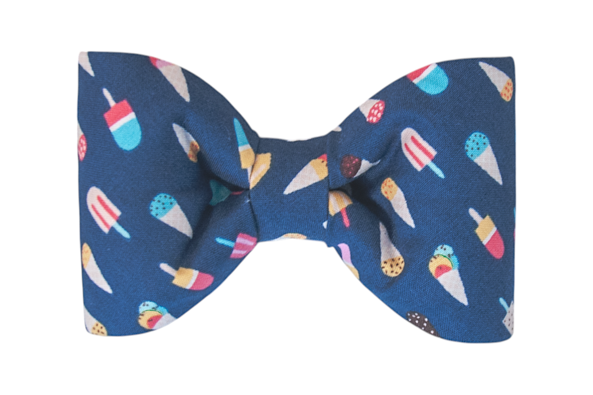 A dark blue fabric bow tie with rounded edges, covered in a playful ice cream and popsicle print in bright colors like red, yellow, turquoise, and white. The bow is neatly cinched at the center and designed for your best pup pal.