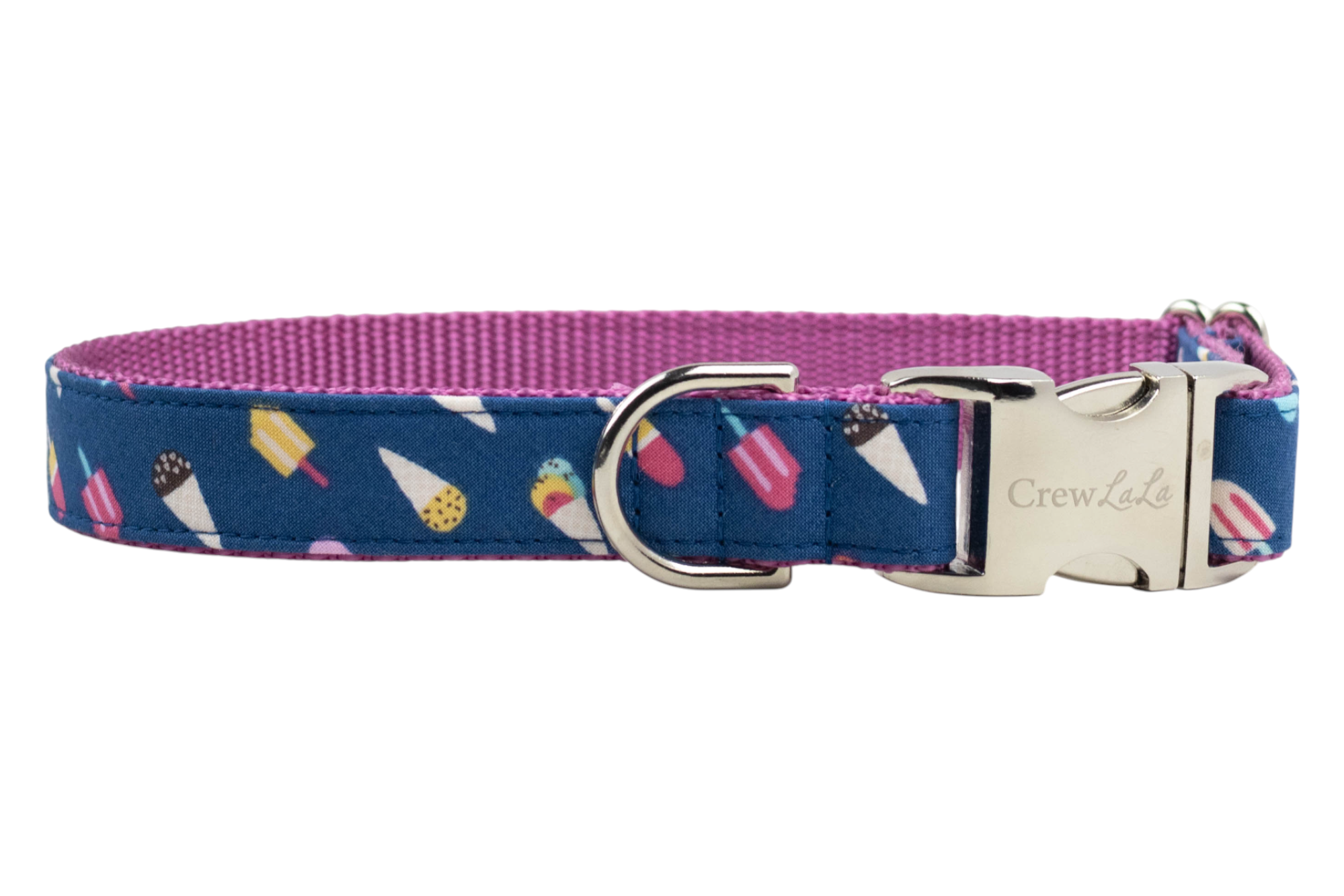 Adjustable dog collar with a navy blue exterior fabric featuring a fun ice cream and popsicle print. The inner lining is a vibrant pink webbing, and the collar is finished with a shiny silver metal D-ring and a silver buckle engraved with the brand name “Crewlala.”