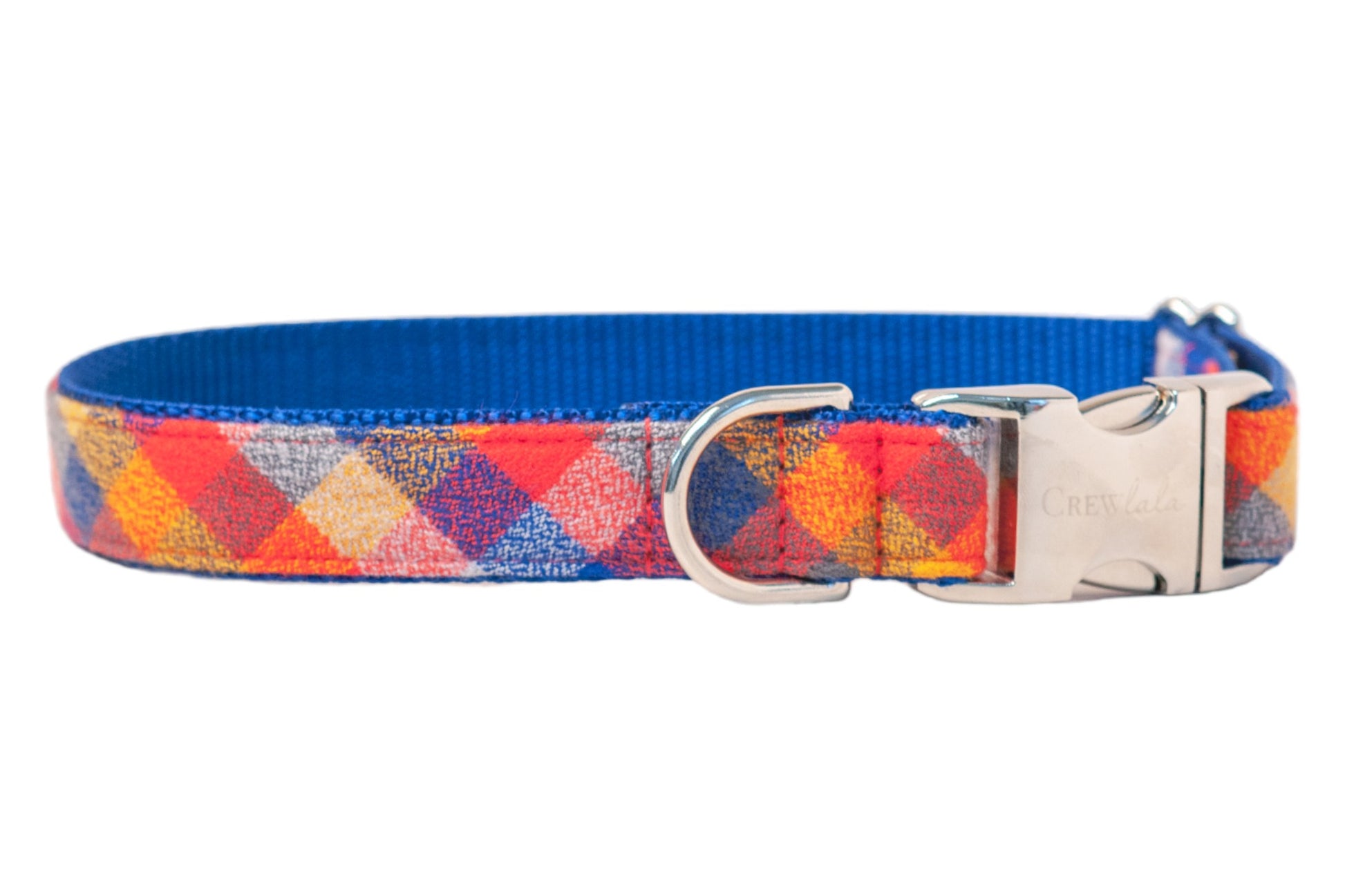 Colorful plaid dog collar in intersecting red, orange, blue, checks, backed with strong woven blue webbing. Fitted with a metal D-ring, adjustment slider, and engraved side-release buckle.