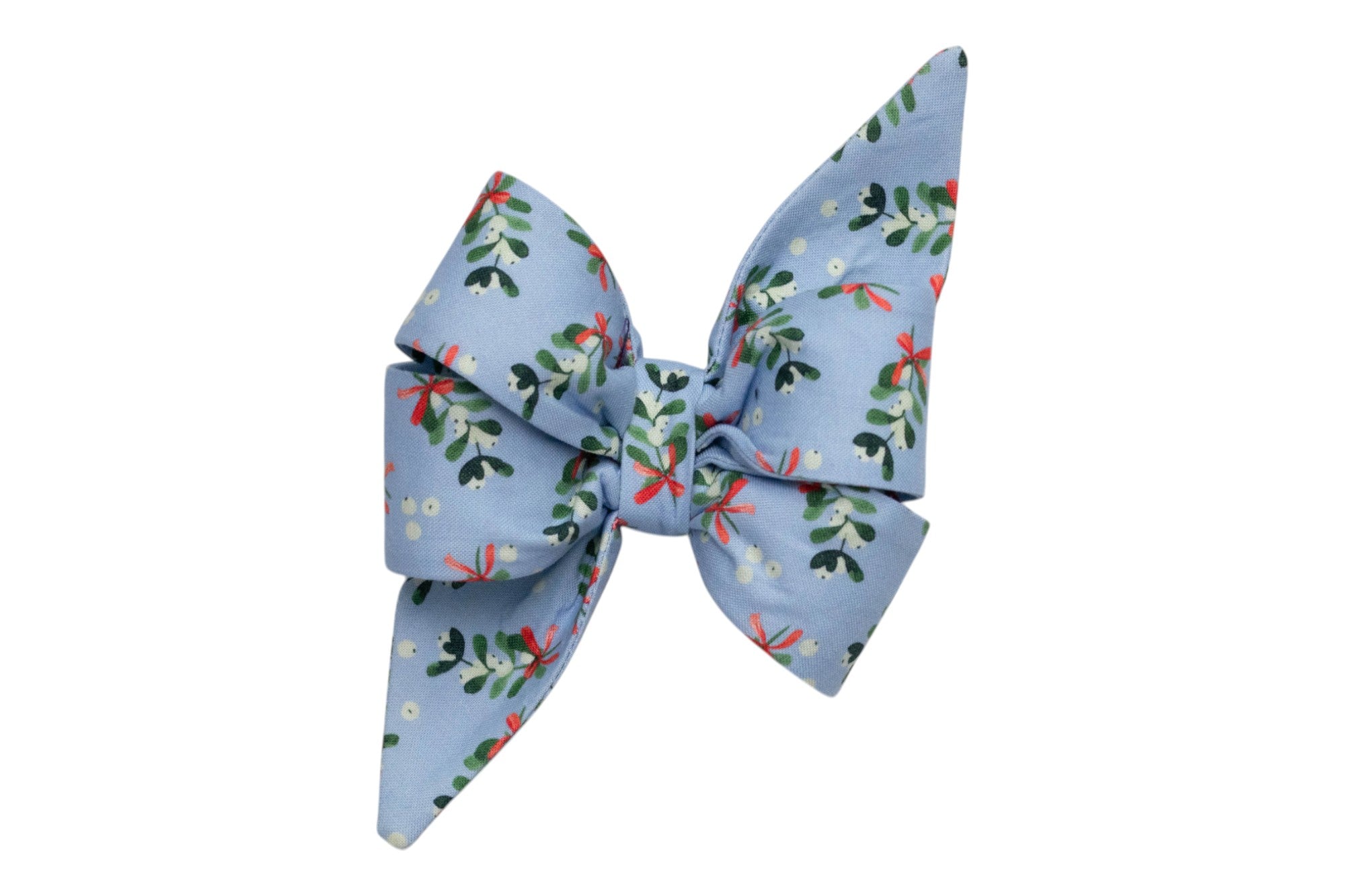 Winter-inspired dog belle bow in pastel blue fabric with a repeating mistletoe print, including leaves, berries, and small ribbons. The oversized design includes dramatic loops and long pointed tails, creating a playful yet elegant seasonal look.