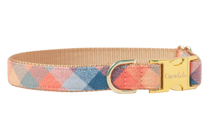 Stylish flannel dog collar with a diamond plaid pattern in muted tones, mounted on nylon webbing, accented by polished hardware including a buckle engraved with “Crewlala” and a sturdy D-ring.